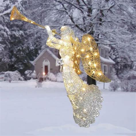 outdoor christmas angel with trumpet|More.